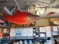 Fish figures hang inside Totem Smokehouse